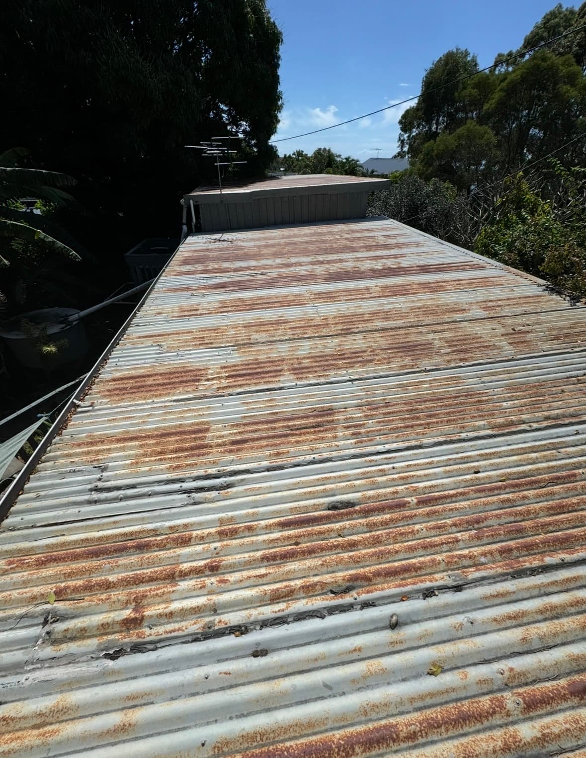 Roof before restoration - rusty and worn